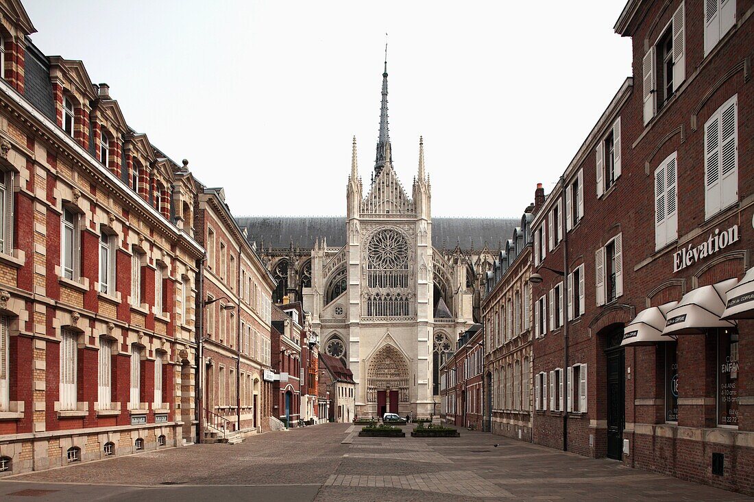The view of one of the Gothic tower of Cathedral Notre Dame from old town. Amiens. Picardy. France