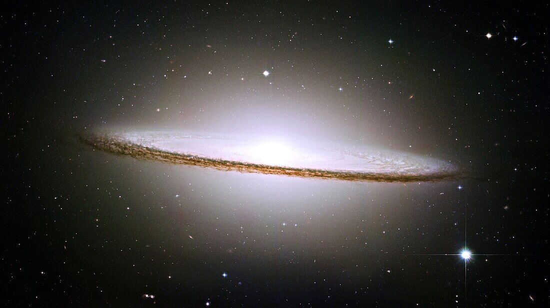 NASA´s Hubble Space Telescope has trained its razor-sharp eye on one of the universe´s most stately and photogenic galaxies, the Sombrero galaxy, Messier 104 M104  The galaxy´s hallmark is a brilliant white, bulbous core encircled by the thick dust lanes