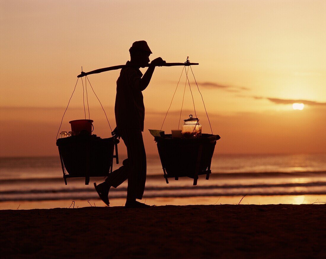 Bali, Balinese, beach, buckets, carry, carrying, ca. Bali, Asia, Balinese, Beach, Buckets, Carry, Carrying, Catch, Evening, Fisherman, Holiday, Indonesia, Indonesian, Kuta, Landmark