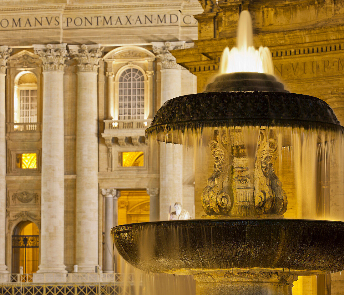 Fountain in front of St. Peter's basilica in the evening light, Basilica Papale di San Pietro in Vaticano, St. Peter's square, Rome, Lazio, Italy