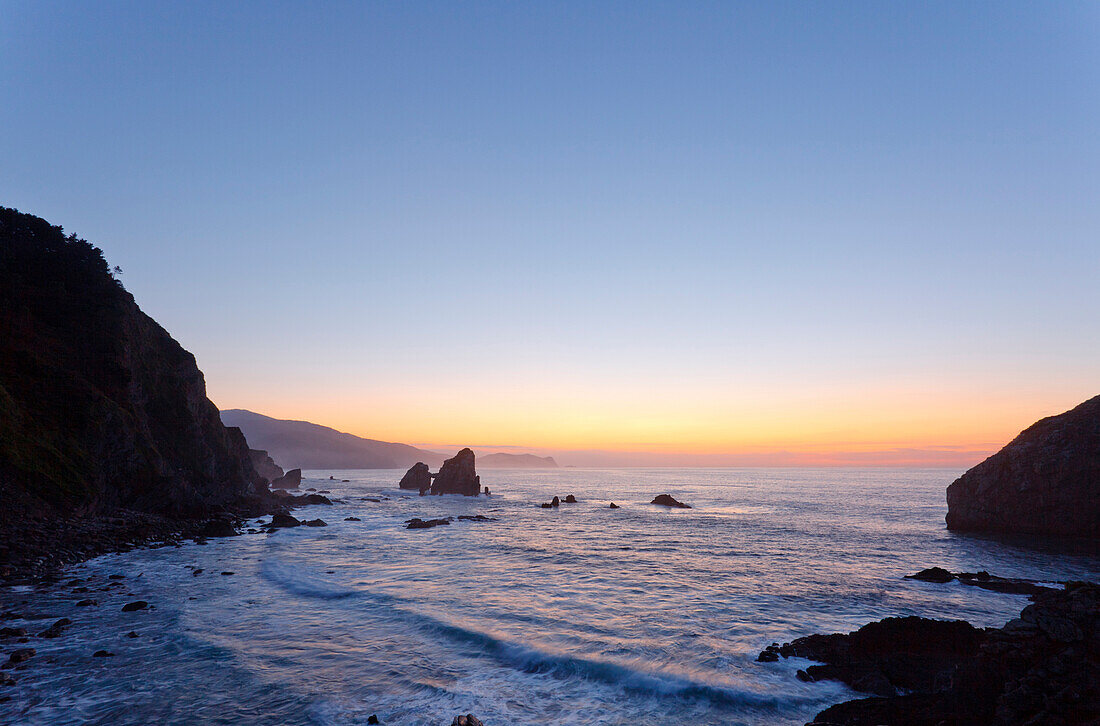 Steep coast at San Juan de Gaztelugatxe at sunset, Cape of Matxitxako, province of Guipuzcoa, Basque Country, Euskadi, Northern Spain, Spain, Europe