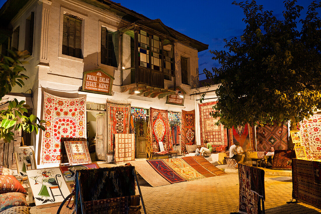 Carpet shop in Kas by night, lycian coast, Lycia, Mediterranean Sea, Turkey, Asia