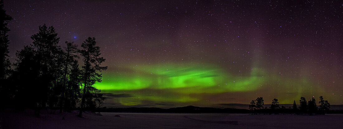 Polarlight, Aurora Borealis at lake Nangujaervi at night, Lapland, Finland, Europe