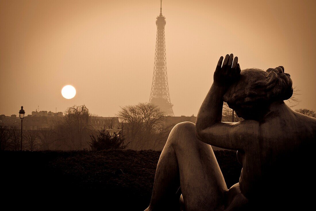 Eiffel Tower and sculptures at sunset from Tuileries Garden  Paris, France