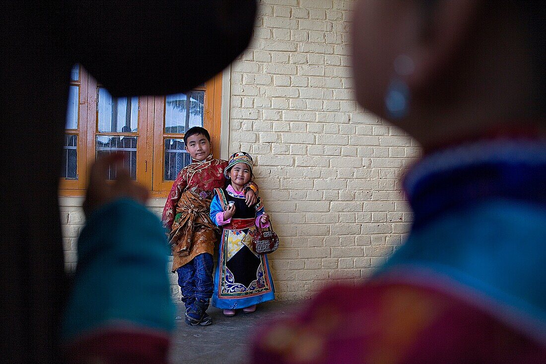 Tibetan children wearing typical dress, in Namgyal Monastery, in Tsuglagkhang complex  McLeod Ganj, Dharamsala, Himachal Pradesh state, India, Asia