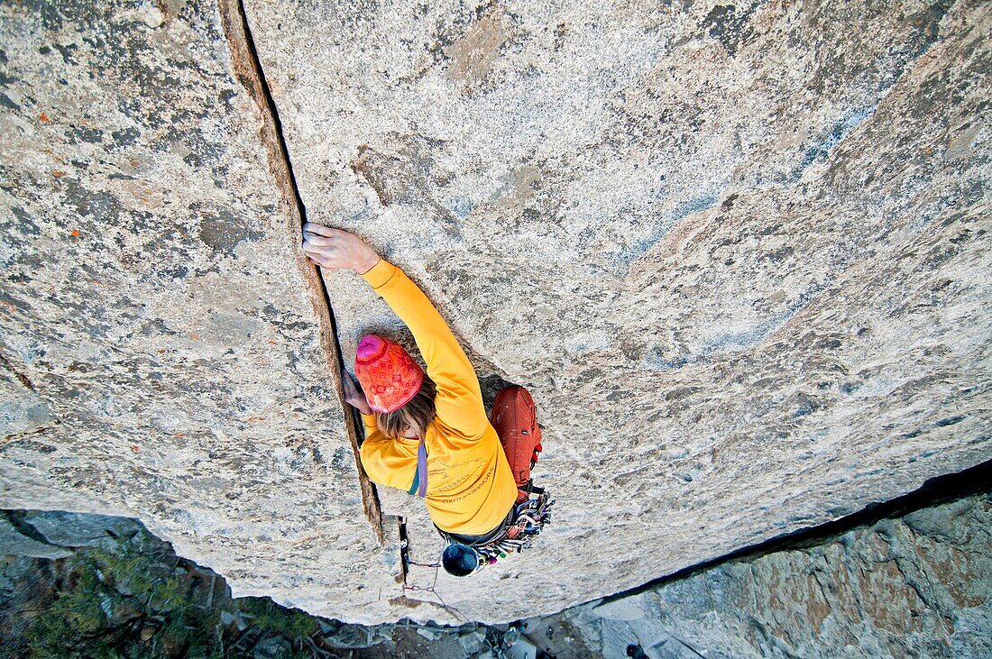 Nic Houser rock climbing a route called Bloody Fingers which is rated 5, 10 and located on Super Hits Wall at the City Of Rocks National Reserve near the town of Almo in southern Idaho