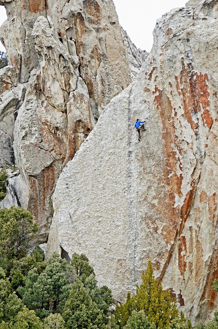 Rock climbing a route called True Grit which is rated 5, 9 and located on the True Grit formation at Castle Rocks State Park near the town of Almo in southern Idaho