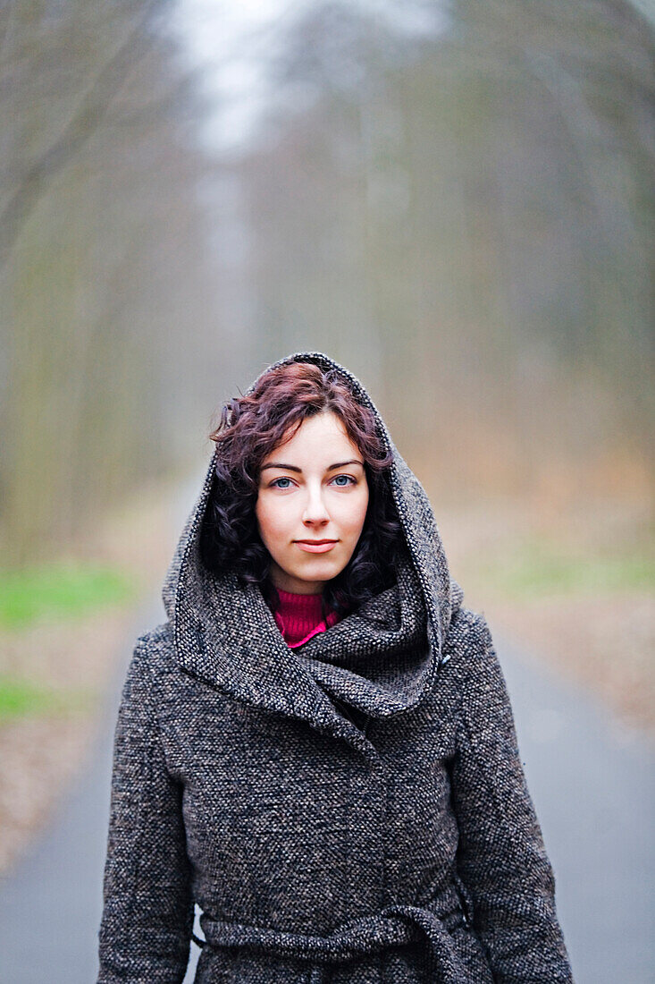 Woman enjoying a walk in the park in Winter