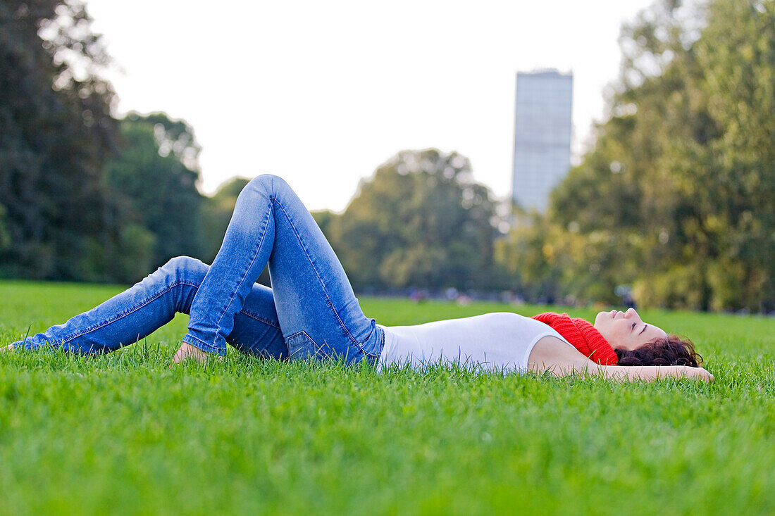 Beautiful woman lying down in park