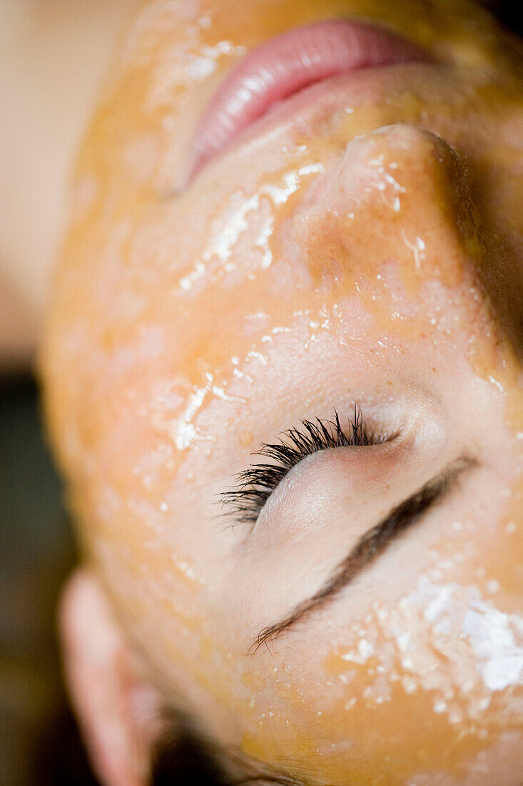 young woman with chocolate_mask closeup