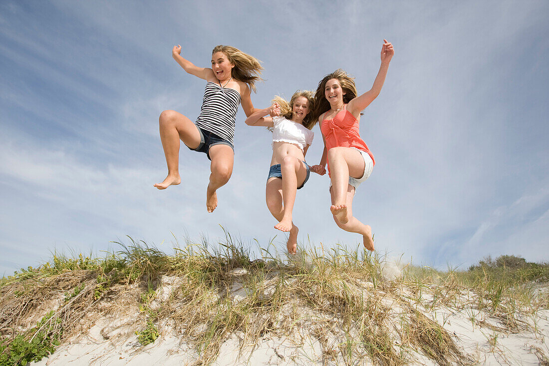 Teenage Girls jumping on Beach. Teenage Girls jumping on Beach