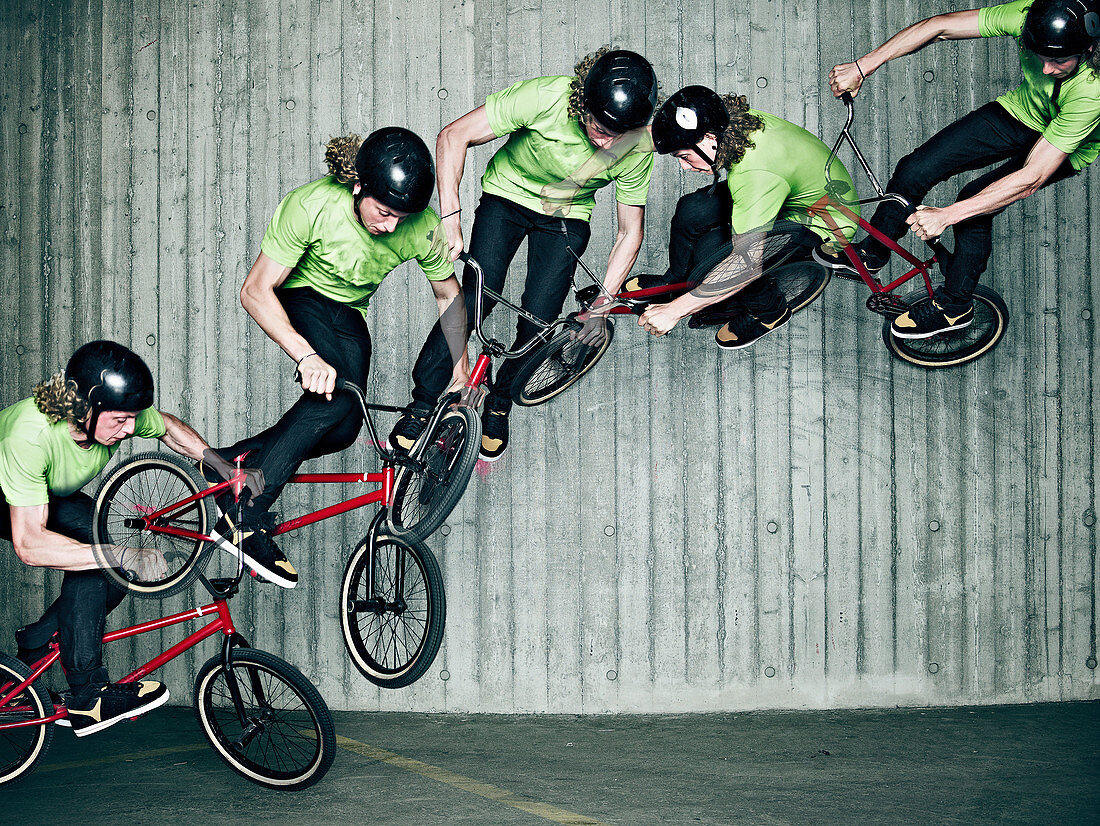 Multiple exposure of man doing bmx trick. Multiple exposure of man doing bmx trick