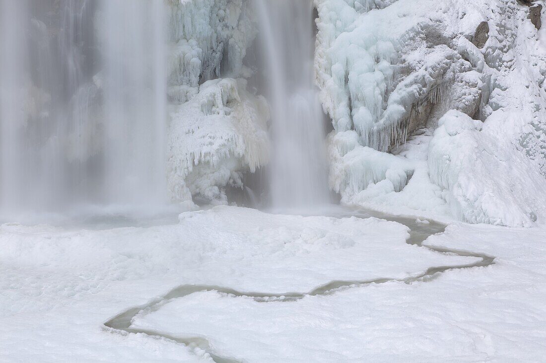 The Krimml waterfalls in the National Park Hohe Tauern during winter in ice and snow  The lower Fall The Krimml waterfalls are one of the biggest tourist attractions in Austria and the Alps  They are visited by around 400 000 tourists every year  The wate