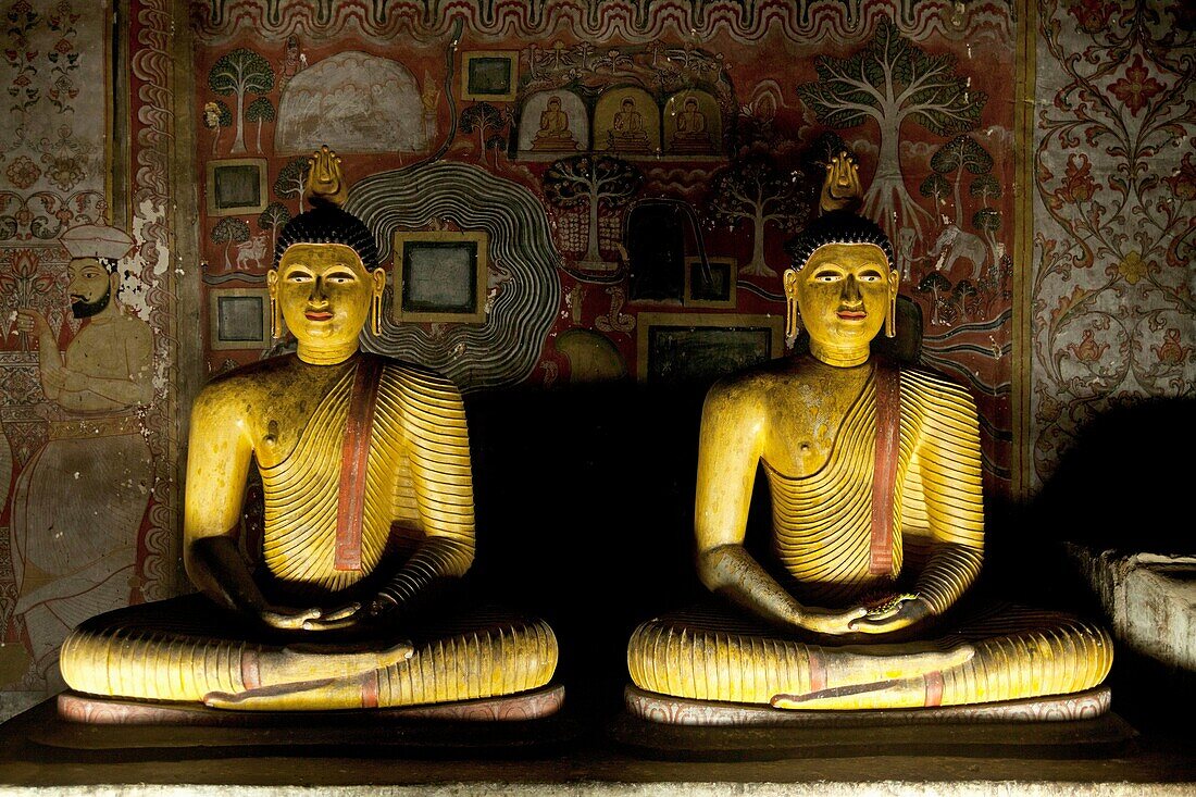 Buddha statues inside Dambulla cave temple complex in Sri Lanka