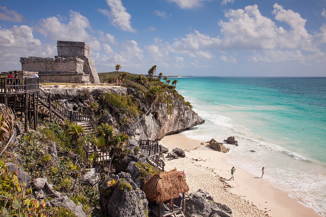Ancient Mayan buildings at Tulum Ruins and people on the beach, Tulum, Riviera Maya, Quintana Roo, Mexico