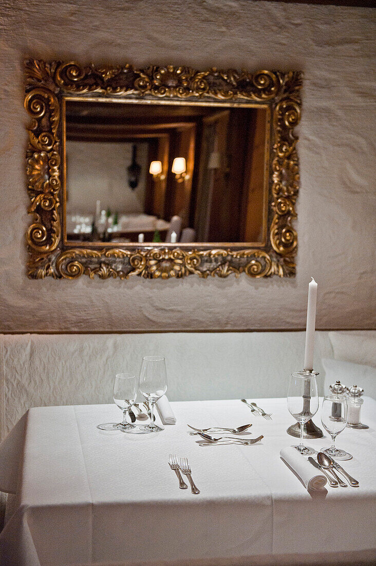 Laid table with mirror on the wall, Lake Achensee, Tyrol, Austria