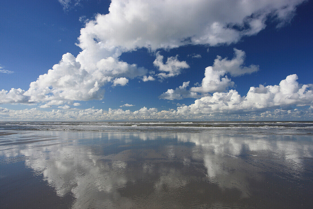 Sea and clouds reflecting in the water, Spiekeroog Island, Lower Saxon Wadden Sea National Park, Lower Saxony, Deutschland