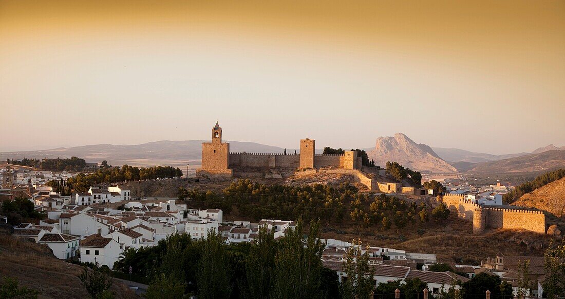 Panoramic view of the sunset of Antequera, notably ´La Alcazaba and the Peña de los Enamorados the background, Antequera, Andalusia, Spain