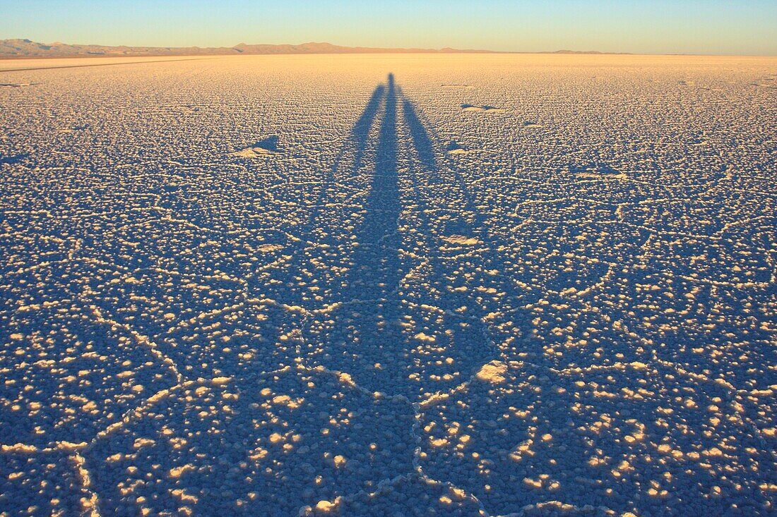 Shadow of a biker on the frozen salt lake called ´Salar de Uyuni´ in Bolivia