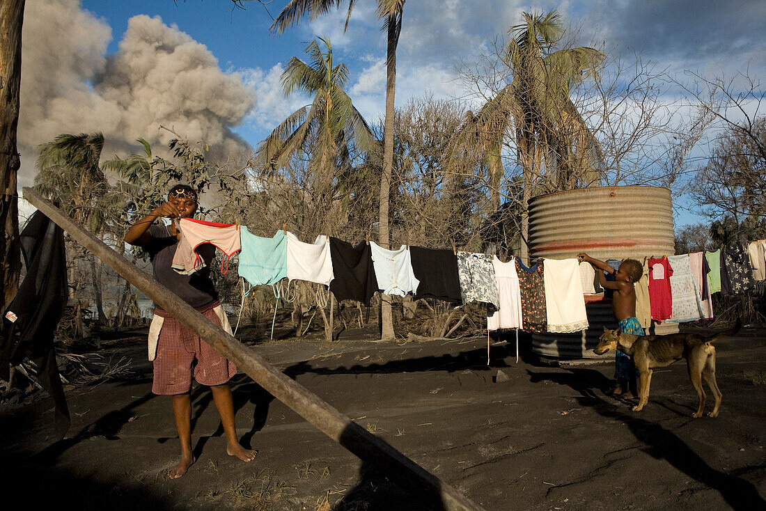 Daily life on Matupit Island has become very difficult due to constant ash fall, Tavurvur Volcano, Rabaul, East New Britain, Papua New Guinea, Pacific