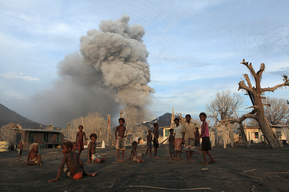 Children on Matupit Island. They have never known their island other then covered in Ash. Tavurvur Volcano, Rabaul, East New Britain, Papua New Guinea, Pacific