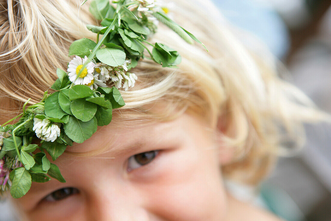 Little girl with flower garland on her head