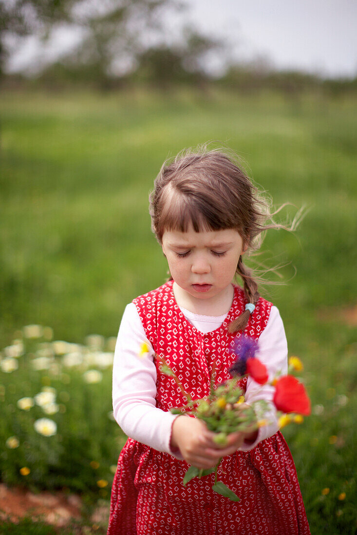 Girl with bunch of flowers, Santanyi, Majorca, Balearic Islands, Spain