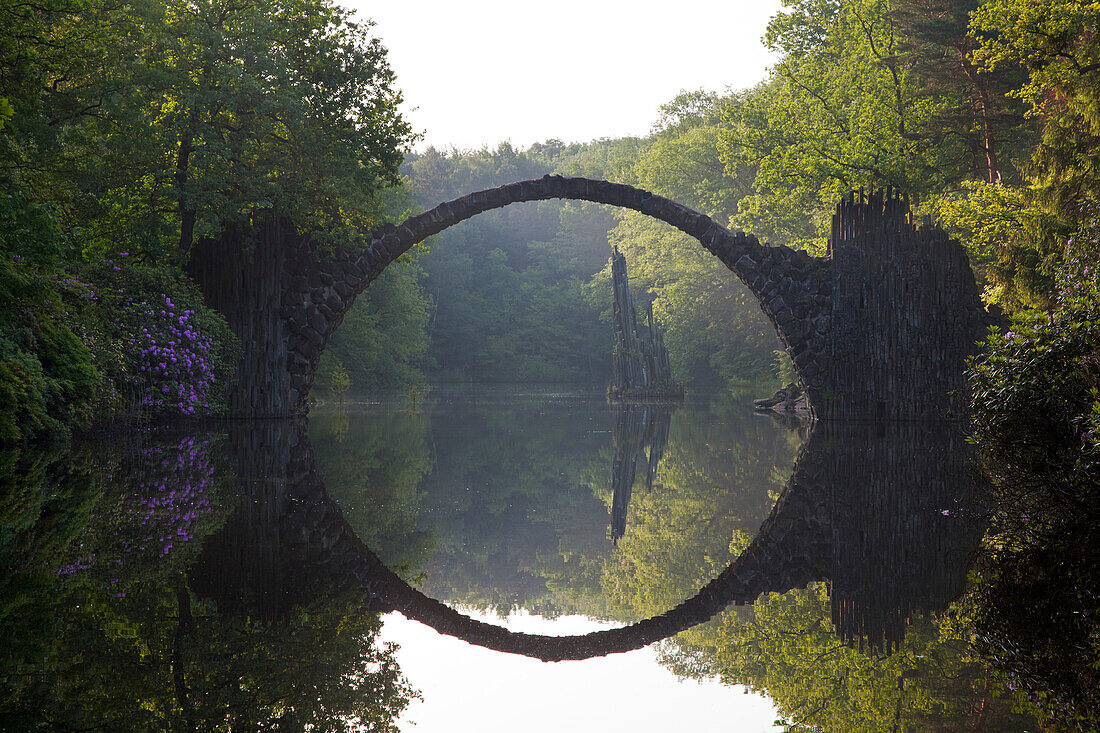 Rakotz bridge reflecting in lake Rakotzsee, Kromlau park, Kromlau, Saxony, Germany, Europe