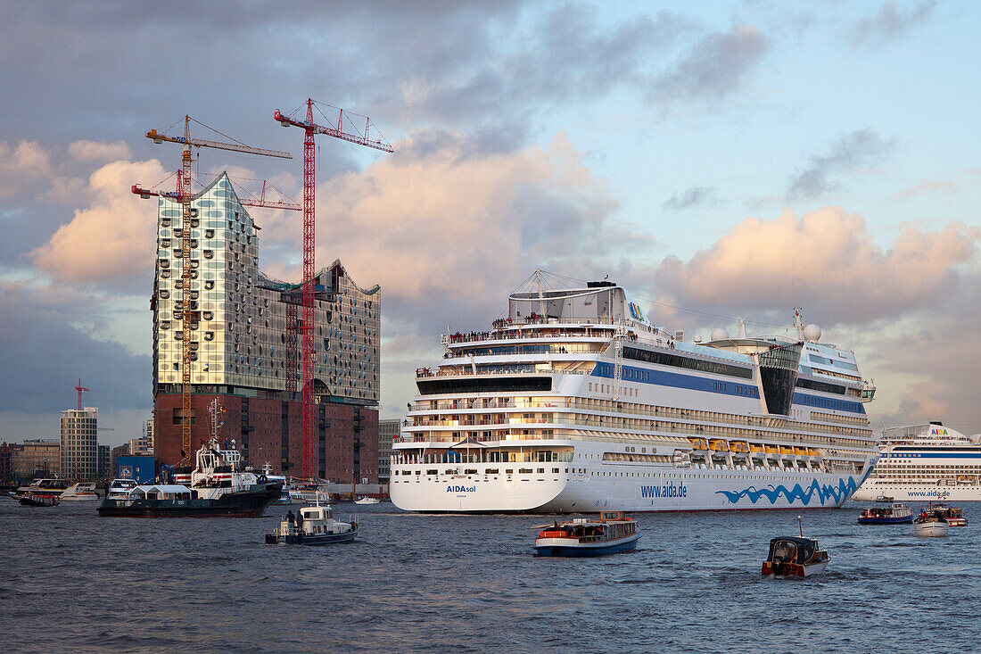 Cruise ship AIDAsol entering port in front of the Elbphilharmonie, Hamburg, Germany, Europe