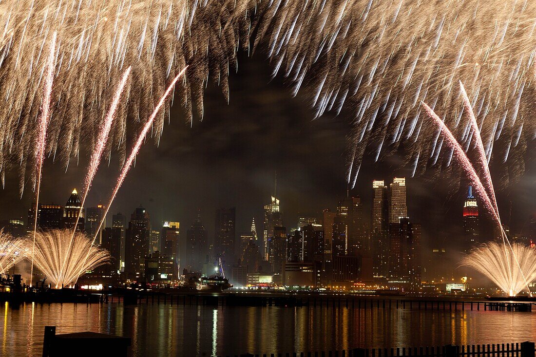 New York - United States, fireworks on Hudson river Manhattan skyline Midtown, Times square buildings