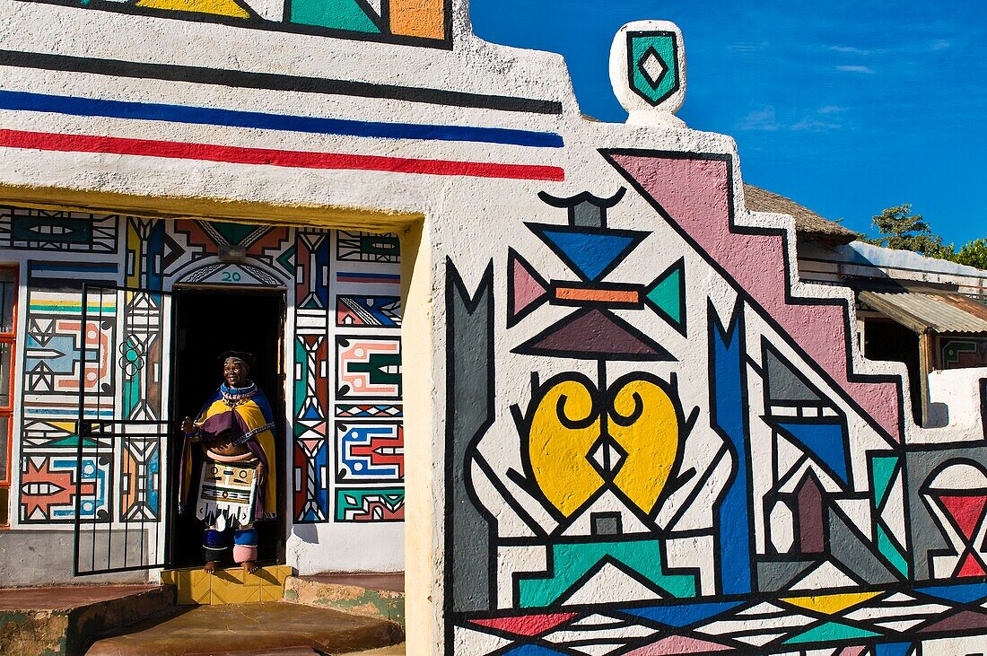 Africa, South Africa, Mpumalanga Province, KwaNdebele, Ndebele tribe, Mabhoko village, the artist Francina Mbonani coming out of her house