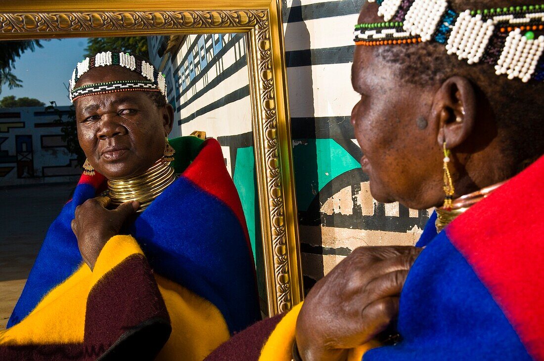 Africa, South Africa, Mpumalanga Province, KwaNdebele, Ndebele tribe, Mabhoko village, the artist Francina Ndimande preparing herself