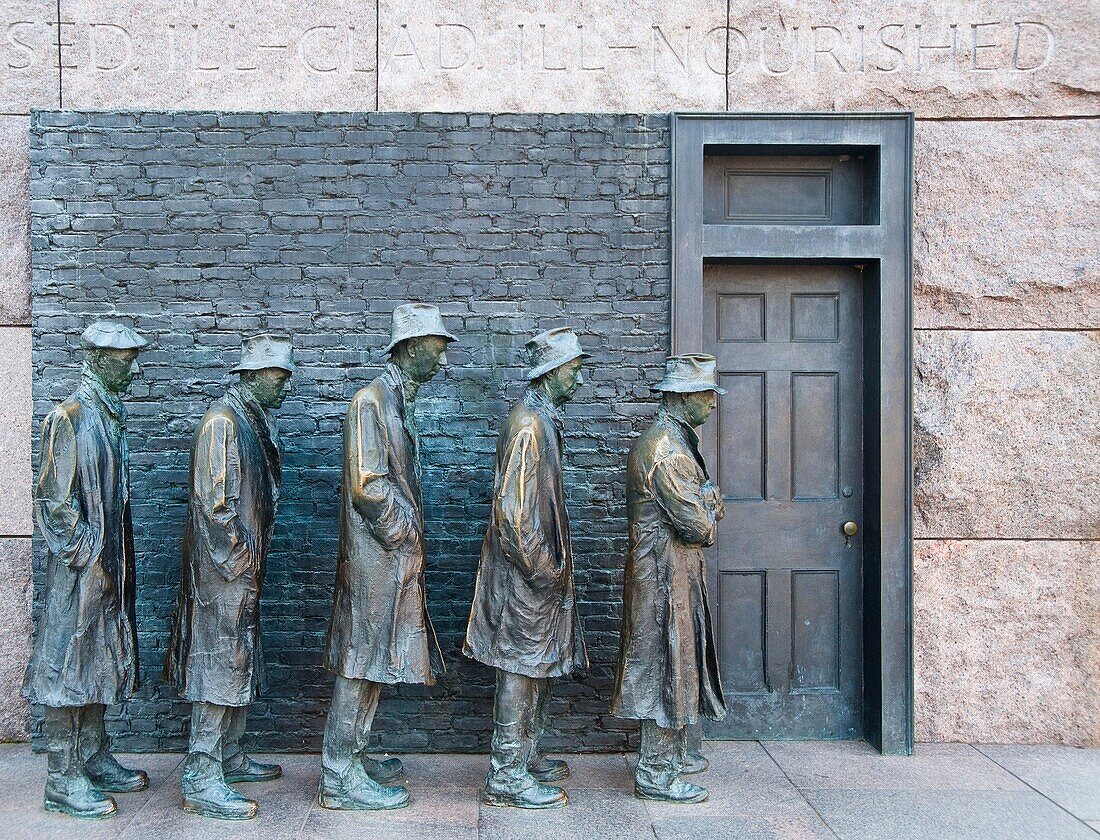 Detail of a bronze statue depicting men standing in a soup line at the FDR Memorial in Washington DC
