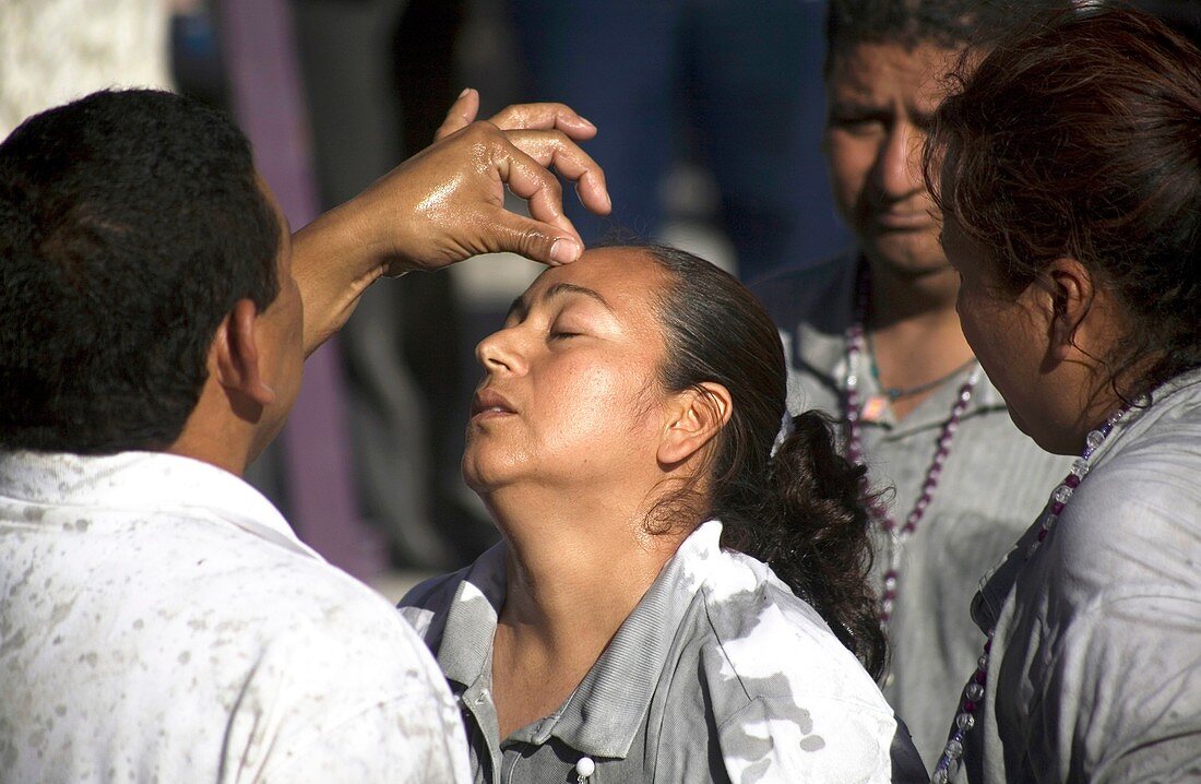A medium heals a pilgrim during Nino Fidencio celebrations in Espinazo, Nuevo Leon state, Mexico.