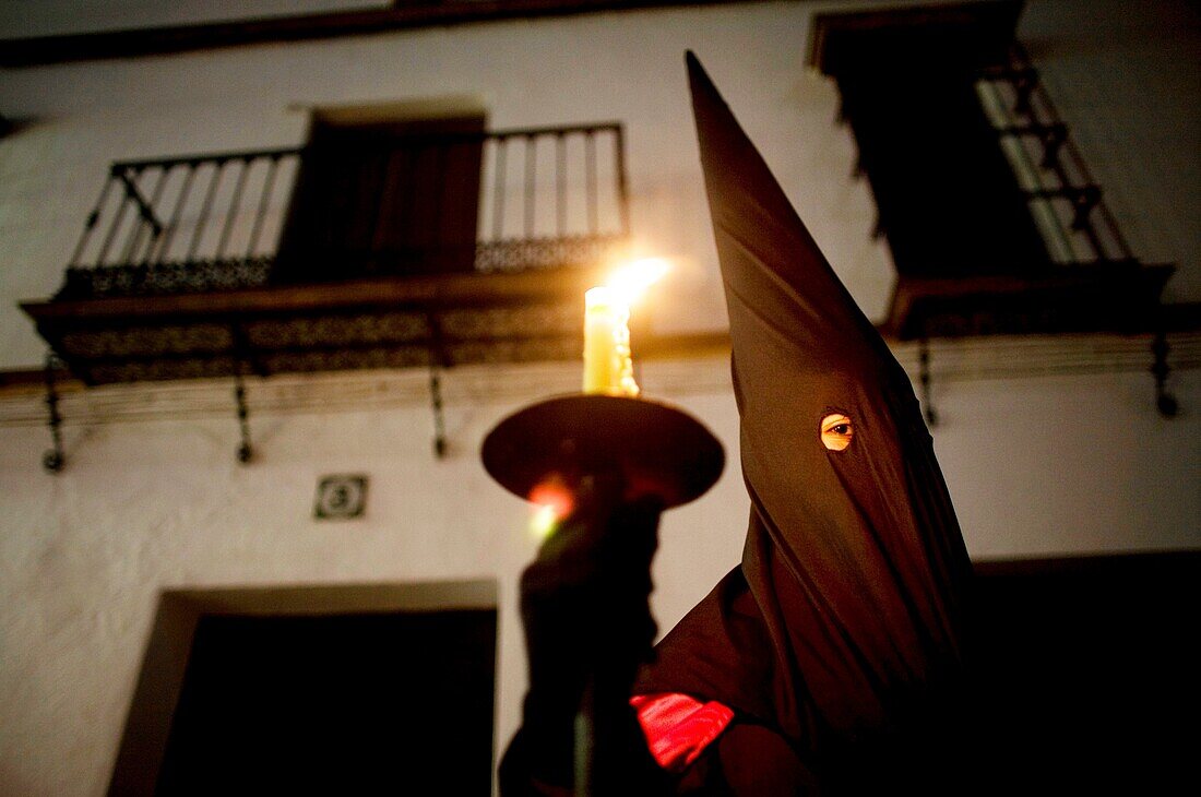 A penitent participates in a Holy Week procession in the town of Prado del Rey in southern Spain´s Cadiz Sierra region in Andalucia. Easter processions in Andalucia during Holy Week are a public display of Catholic imagery which tells the story of Jesus C