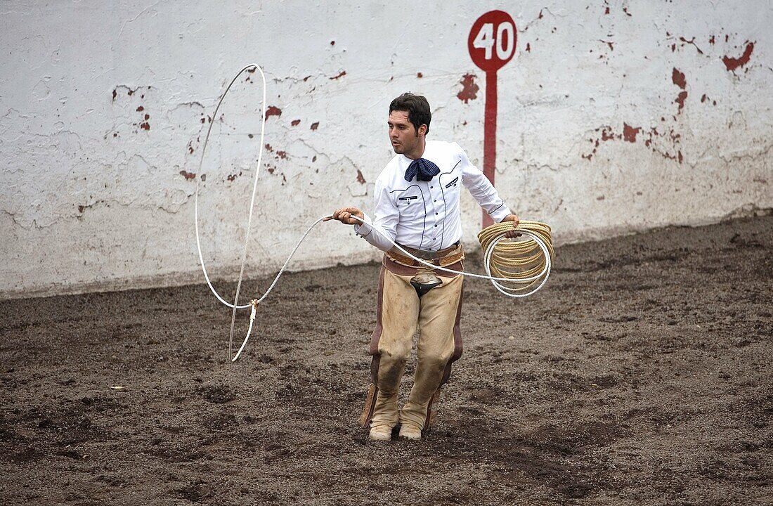 A Mexican charro practices his lasso in Mexico City, August 17, 2008  Male rodeo competitors are ´Charros, ´ from which comes the word ´Charreria ´ Charreria is Mexico´s national sport