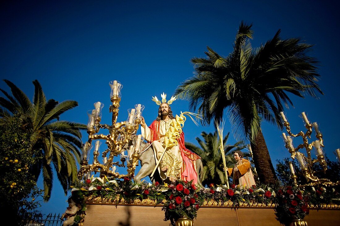 A sculpture of Jesus riding a donkey is carried during a religious procession during the palm sunday in the town of Prado del Rey in southern Spain´s Cadiz Sierra region in Andalucia, March 28, 2010  Easter processions in Andalucia during Holy Week are a