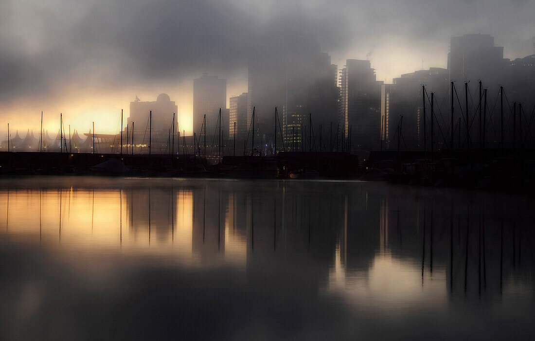 Early morning fog and mist over the waterfront and tall buildings of Vancouver., Vancouver skyline