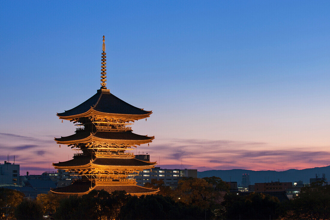 The historic To-ji Temple Pagoda in Kyoto is in the Historic Monuments of Ancient Kyoto UNESCO world heritage site, and has a striking tall tower. It was built in the 8th century., To-ji Temple Pagoda in Kyoto, Japan