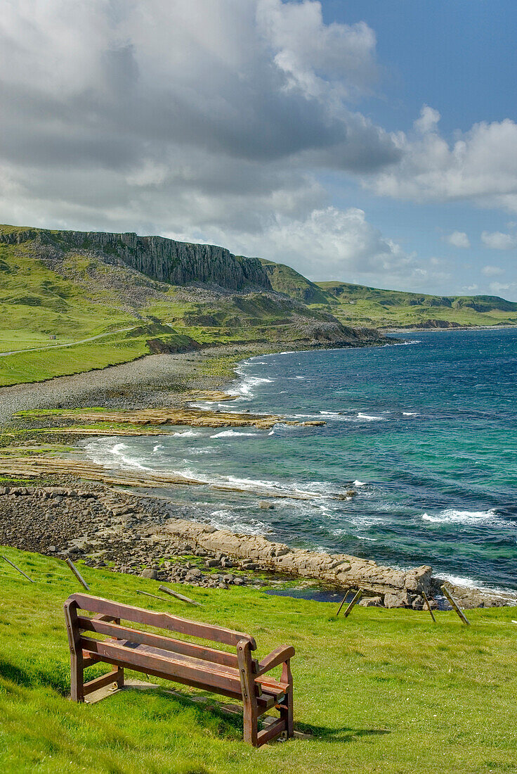 View over the coastline of the island of Skye, on the west coast of Scotland. A bench and viewing point on the cliffs., North Coast of Isle of Skye Scotland