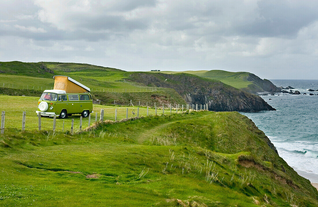 A campervan parked on the clifftops on the Northern coast of Scotland, at Durness., Durness, northern coast of Scotland