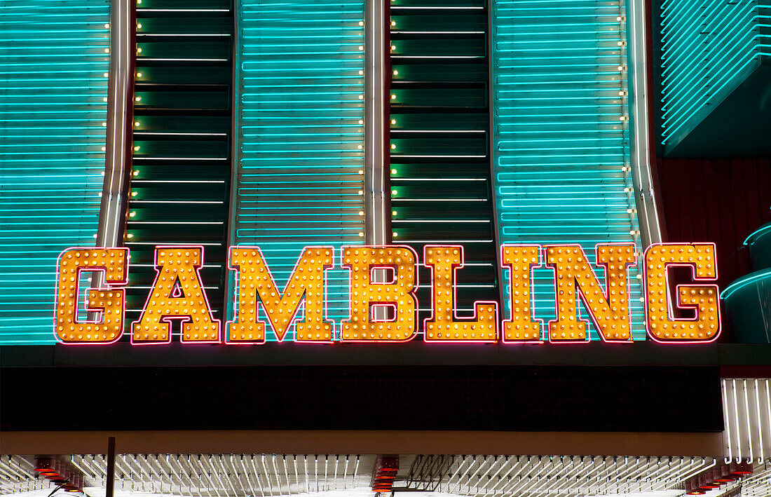 A Casino entrance to a building in the gambling and entertainment centre of Las Vegas city. Neon lights. Night life. The word Gambling in bright neon lights., Las Vegas, Nevada, USA