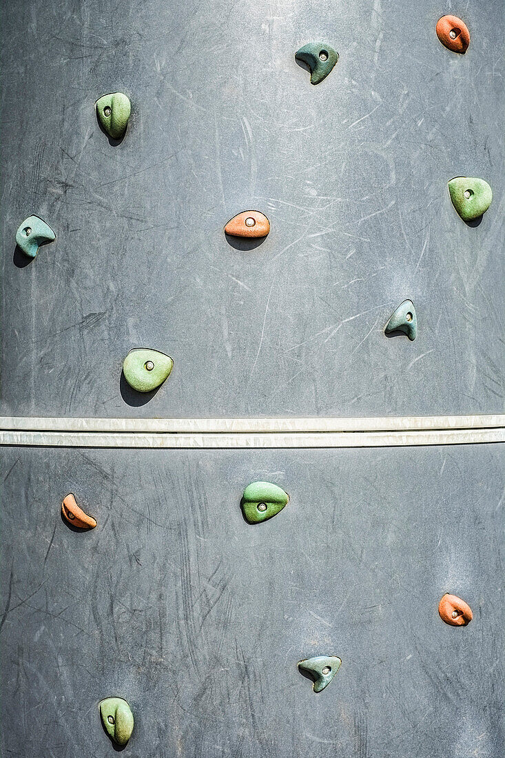 A Climbing wall with a series of hand and foot holds, in a playground or sports centre in Hockinson, Washington, USA, Climbing wall on playground