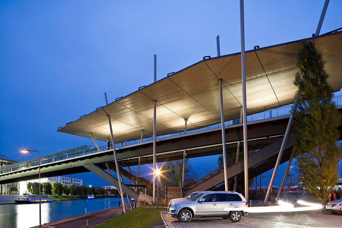 Illuminated Stadtbruecke in the evening, Autostadt, Wolfsburg, Lower Saxony, Germany, Europe