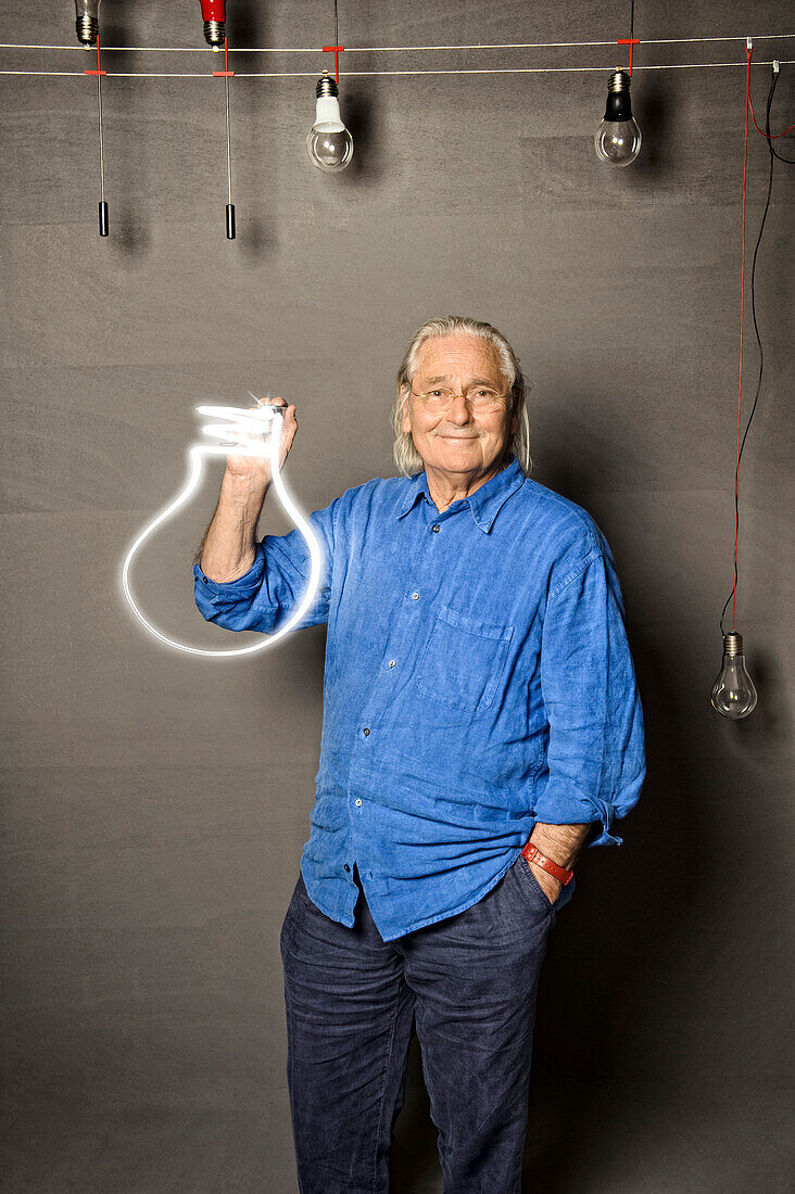 Ingo Maurer, industrial designer, photographed in his munich showroom, Schwabing, Munich, Bavaria, Germany, Europe