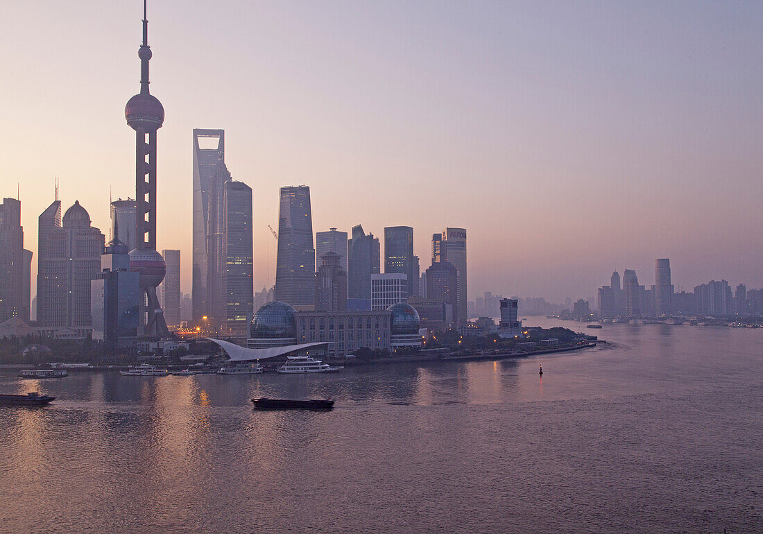 Skyline of Pudong at the Huangpu River at sunrise, Pudong, Shanghai, China, Asia