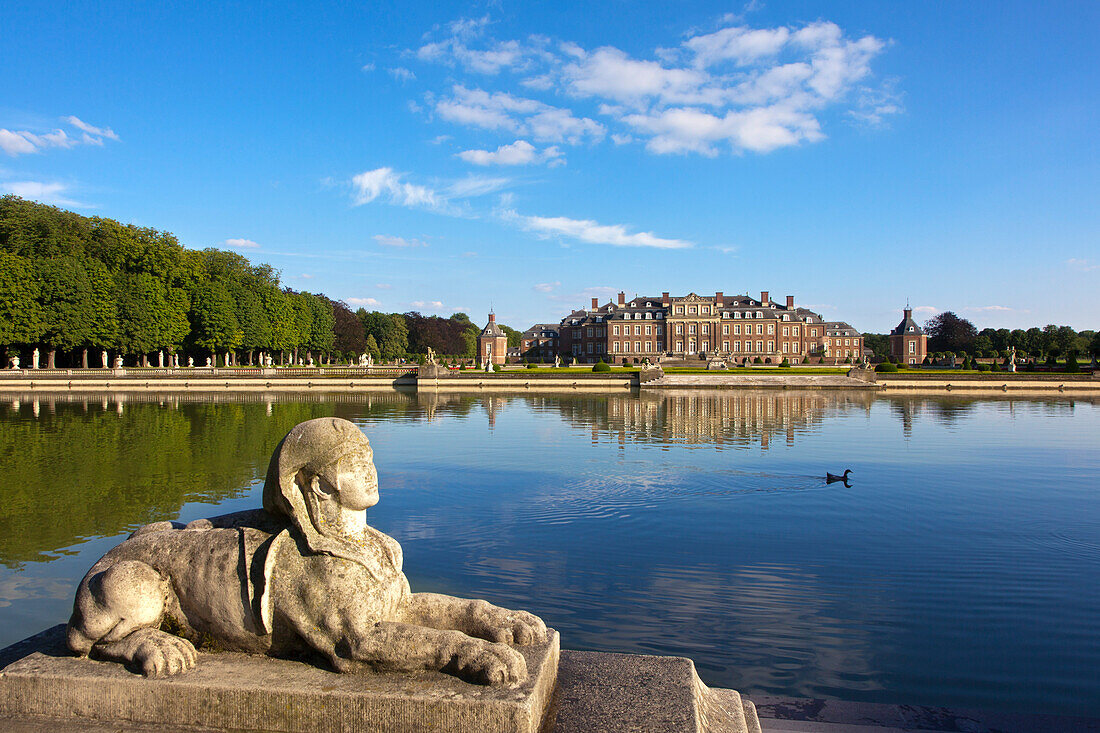 Sphinx at the stairs at the pond, Nordkirchen moated castle, Muensterland, North Rhine-Westphalia, Germany, Europe