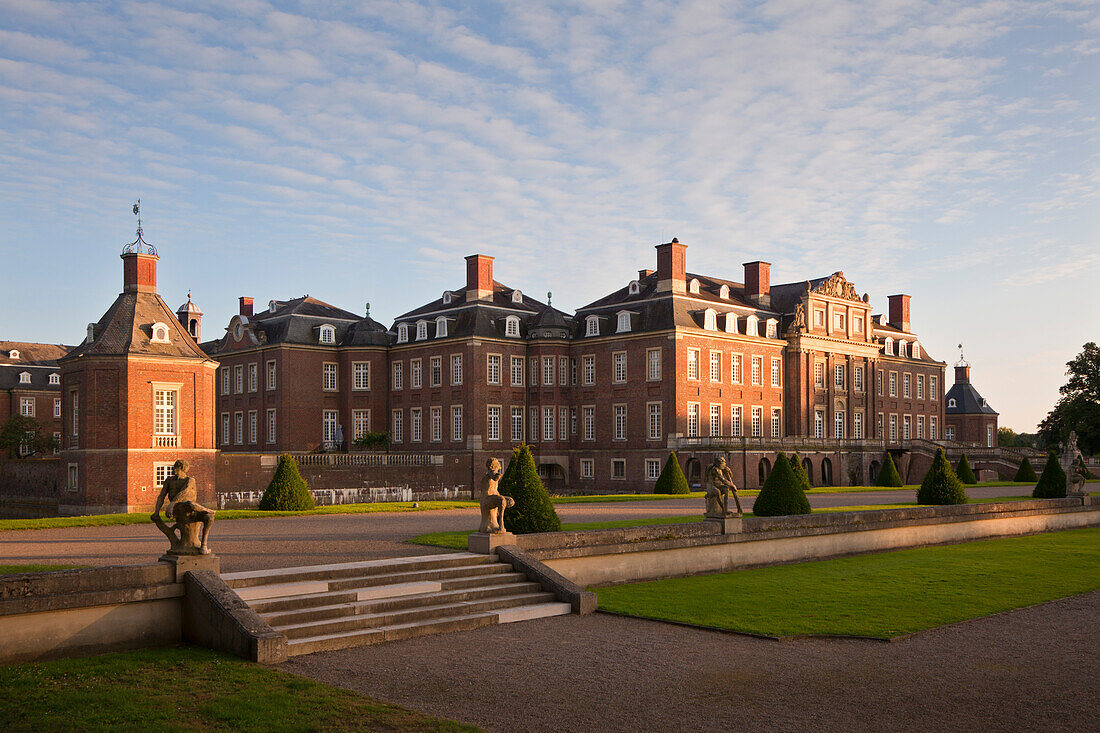 Garden with baroque sculptures at the island of Venus in the evening light, Nordkirchen moated castle, Muensterland, North Rhine-Westphalia, Germany, Europe