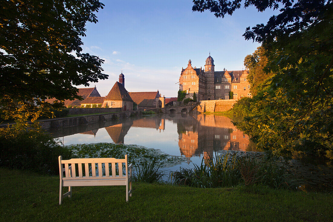 View over the pond onto Haemelschenburg castle, Emmerthal, Weser Hills, North Lower Saxony, Germany, Europe