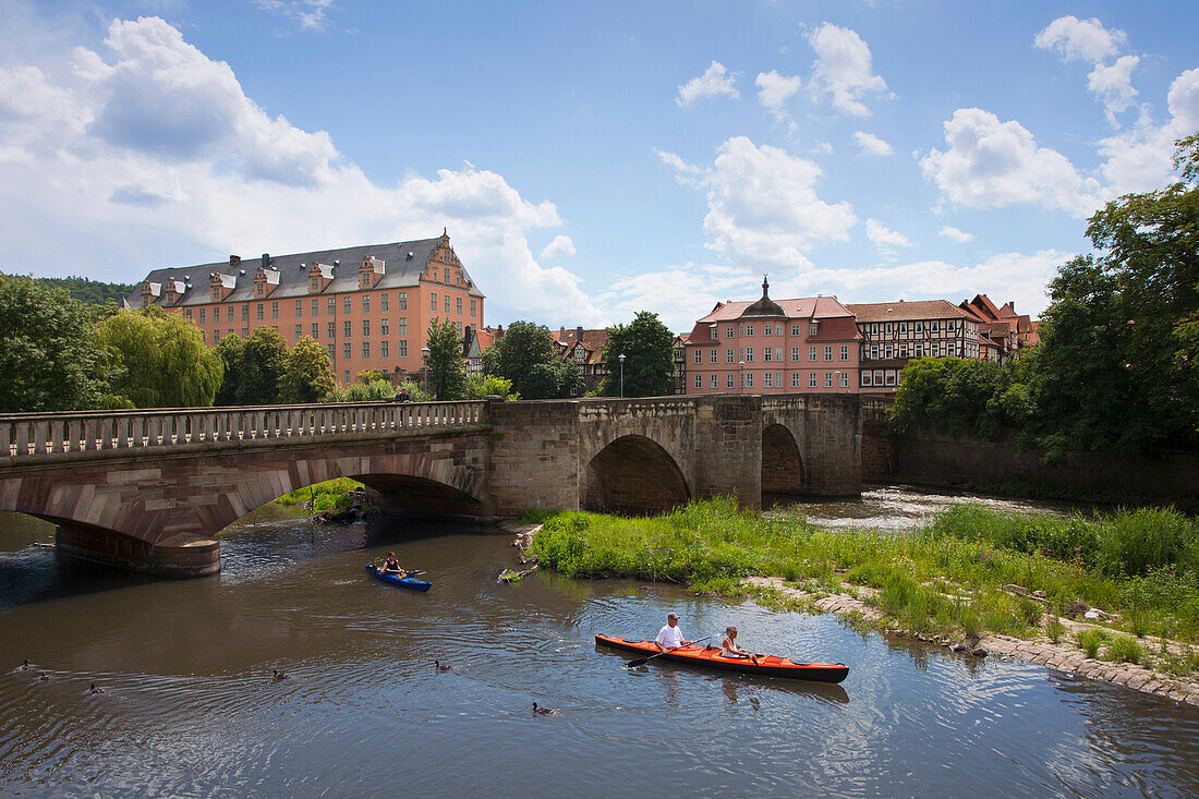 Kayaks on the Werra river, view of the Welfenschloss castle, Hannoversch Muenden, Weser Hills, North Lower Saxony, Germany, Europe
